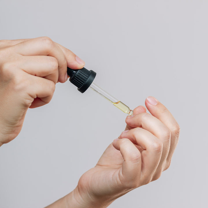 Lady applying nail oil