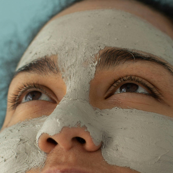 Girl with green face mask on