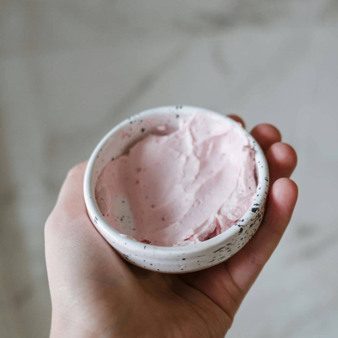 Pink clay mask mixed in a bowl