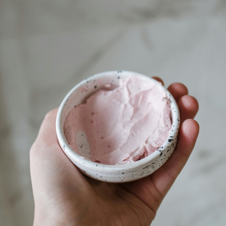 Pink clay mask mixed in a bowl