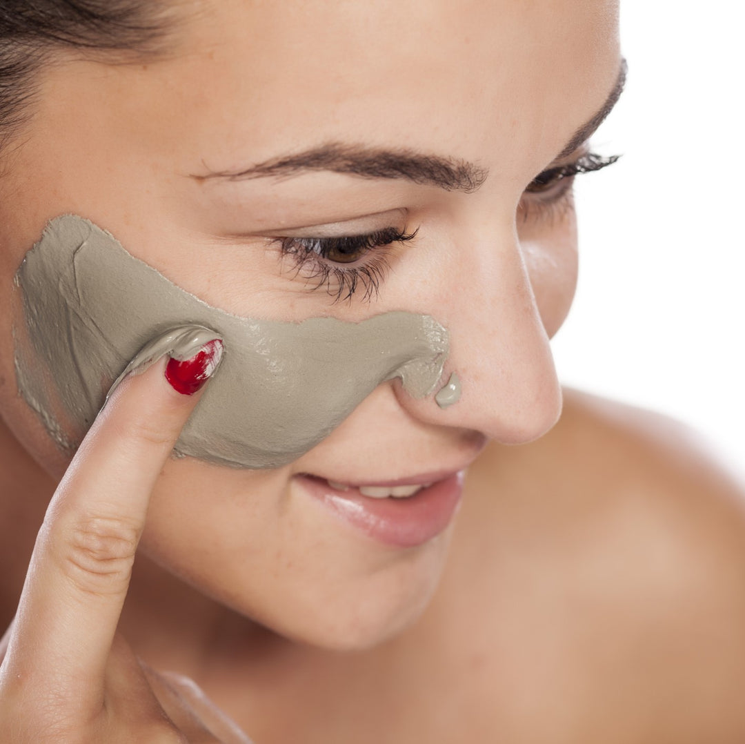 Lady applying face mask