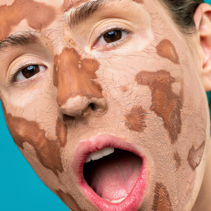 Dried clay face mask on face